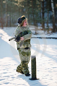 Boys playing with gun during laser tag