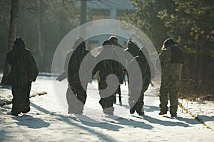 Boys playing with gun during laser tag
