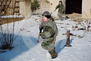 Boys playing with gun during laser tag