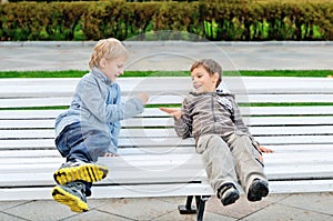 Boys playing rock-paper-scissor