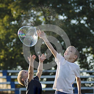 Boys playing with soap bubble