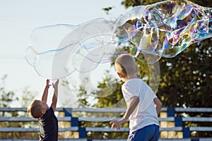 Boys playing with soap bubbles