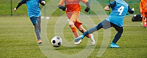 Boys Playing Soccer Game in Autumn Time. Footballers in Soccer Long Sleeve Jersey Clothing