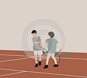 Boys playing tennis with rackets and balls in summer camp at court. Sport