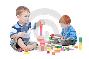 Boys playing with toy blocks