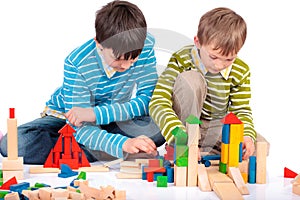 Boys playing with wood blocks