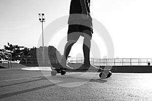 Boys practicing skateboarding during the sunset