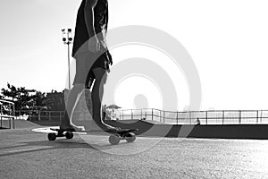 Boys practicing skateboarding during the sunset