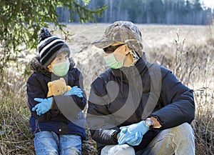 Boys in protective sterile medical mask