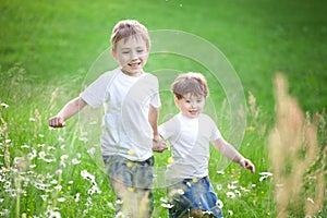 Boys running through field