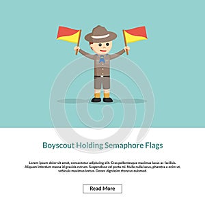 Boys scout holding a semaphore flags