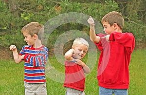 Boys Showing off Muscles