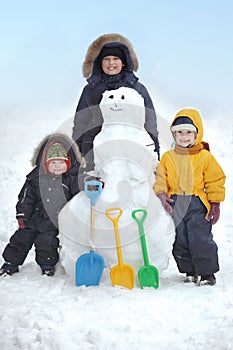 Boys with snow man