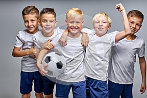 boys soccer team celebrating a victory after match