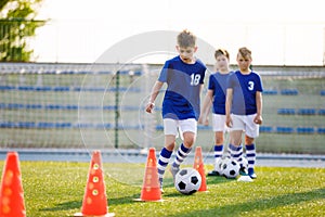 Boys on Sports Training. Football Training Dribbling Cone Drill