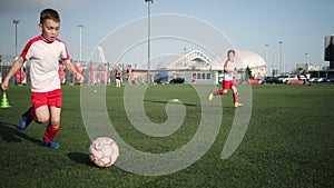 Boys sportsmen are playing soccer