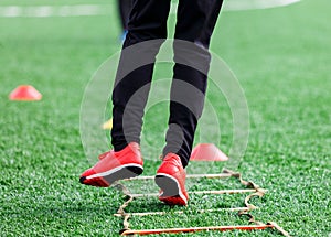 Boys in sportswear running on soccer field. Young footballers dribble . Training, active lifestyle, sport, children activity