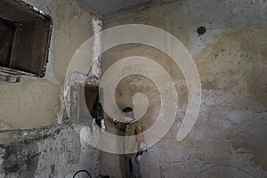 Boys standing in an abandoned building