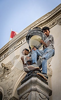 The boys on the street light during the pro-Palestine rally at Tunis.