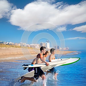 Boys surfers surfing running jumping on surfboards