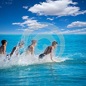 Boys surfers surfing running jumping on surfboards