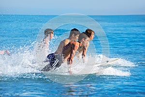 Boys surfers surfing running jumping on surfboards