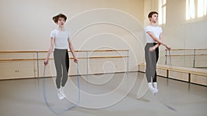 Boys Teenagers Jumping with Skipping Rope, Doing Exercise in Ballet Dance School