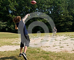Boys tossing football