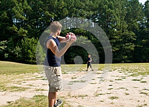 Boys tossing football