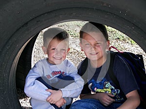 Boys under tire.