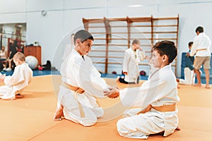 Boys in uniform practice martial art