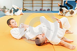 Boys in uniform practice martial art photo