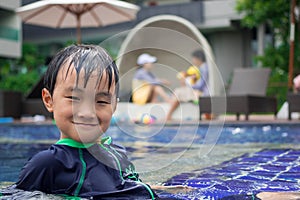 Boys were playing in the swimming pool