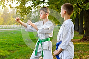 Boys in white kimono during training karate