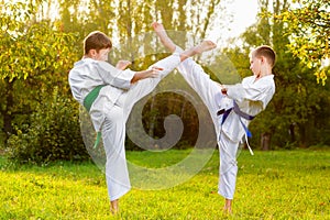 Boys in white kimono during training karate