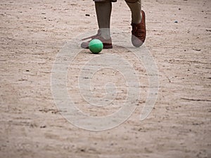 Boyscout Playing Small Green Ball