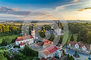 Bozkow palace and church on the panorama of sudety mountains aerial view