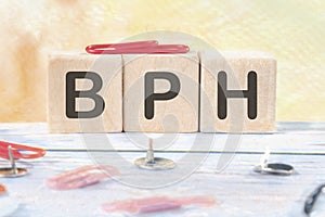 BPH Benign Prostatic Hyperplasia signs on wooden cubes on a light background