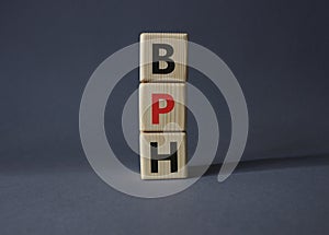 BPH - Benign Prostatic Hyperplasia symbol. Wooden cubes with word BPH. Beautiful grey background. Medical and BPH concept. Copy