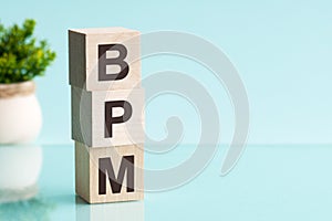 Bpm abbreviation - business process management, on wooden cubes on a light background