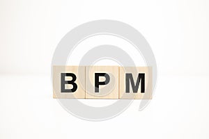 bpm word on wooden cubes. Business concept