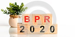 BPR 2020 word written on wood block. Faqs text on table, concept