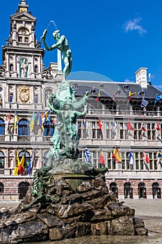 Brabo\'s monument with Stadhuis (City Hall) in the Grote Markt, Antwerp, Belgium