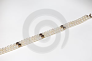 bracelet made of natural pearls, garnet and diamonds with a gold clasp. Yellow gold and precious stones