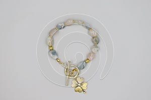 Bracelet made of natural stones on a white background.