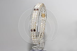 bracelet made of pearls, garnet and diamonds with a gold clasp. Yellow gold and precious stones