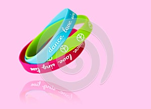 Bracelets with the symbol of peace on a pink background