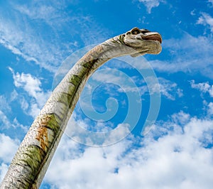 Brachiosaurus against blue cloudy background