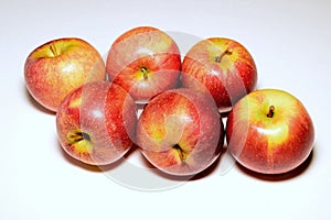 Braeburn apples against a plain white background