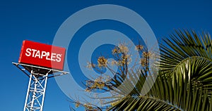 Staples Logo with a vibrant blue sky, Staples are an American office equipment sales company.